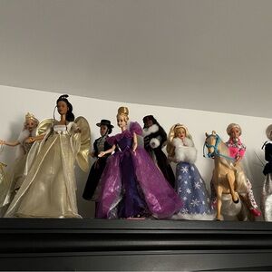 Barbie Dolls Collection with Gold, Purple, and Blue Dresses